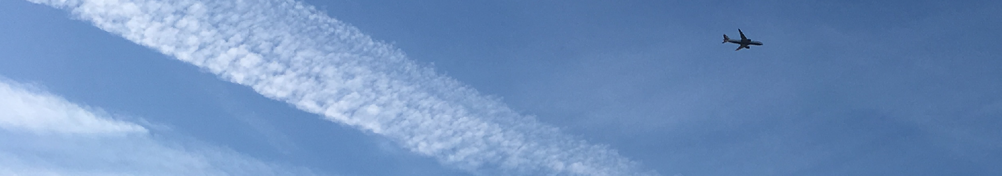 Plane with Contrails